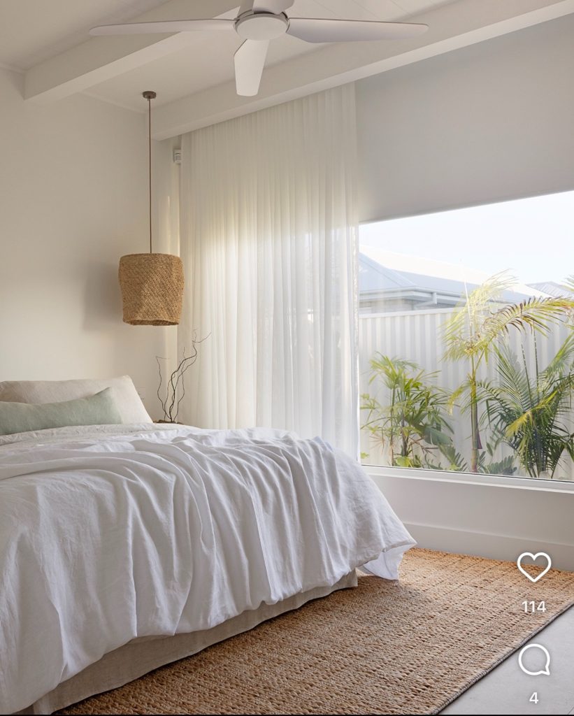 coastal bedroom with transparent white curtain