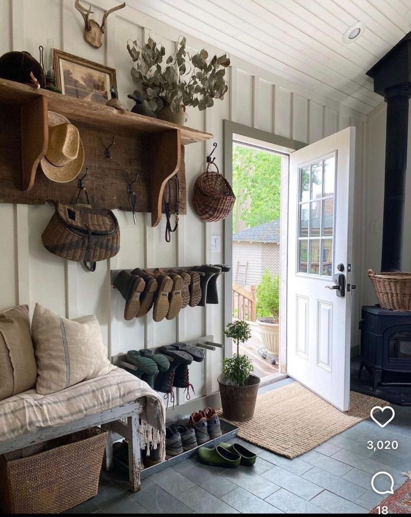 Shiplap Wall With Hooks In A Framhouse Mud Room