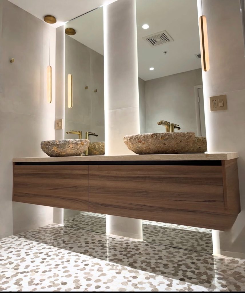 Concrete Sink on a Walnut Vanity In An Earth Tone Bathroom