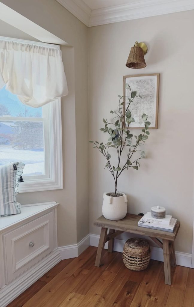 Tiny side table in a bay window reading corner
