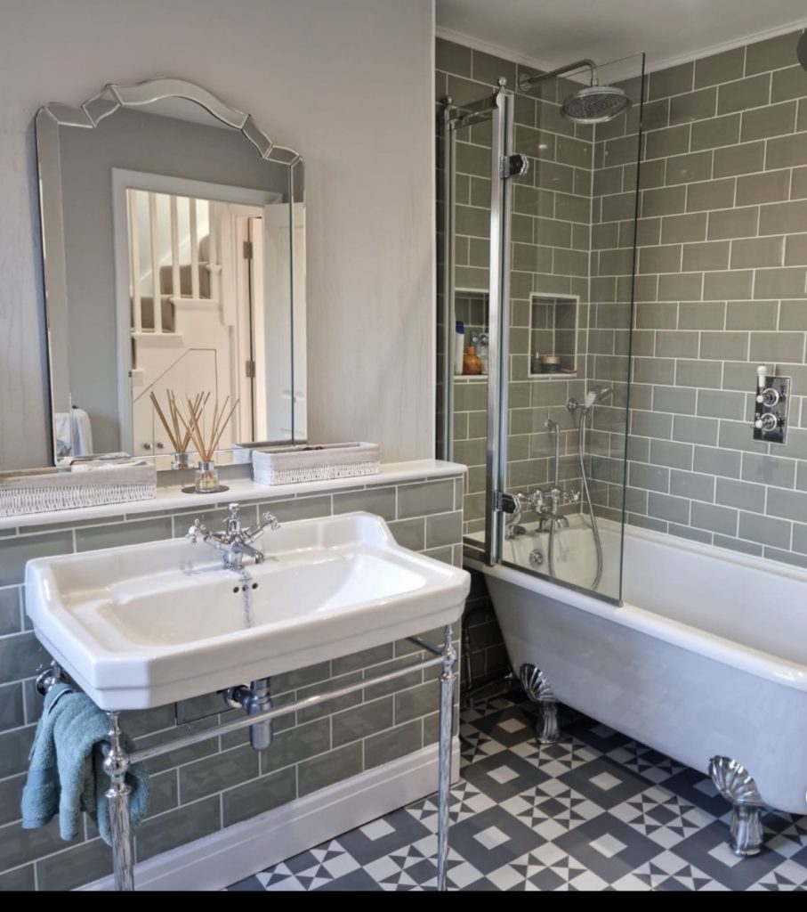 French country bathroom with wrought iron details 