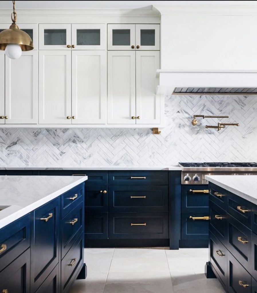 Navy blue island and white upper kitchen cabinet 