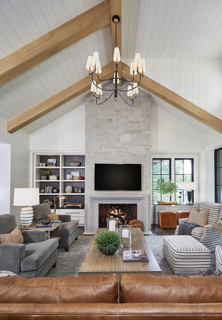 Vaulted living room with shiplap walls 