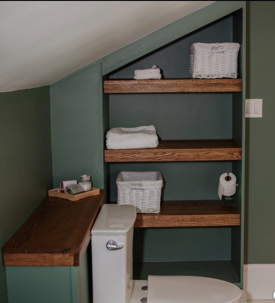 Built in shelves in an attic bathroom 