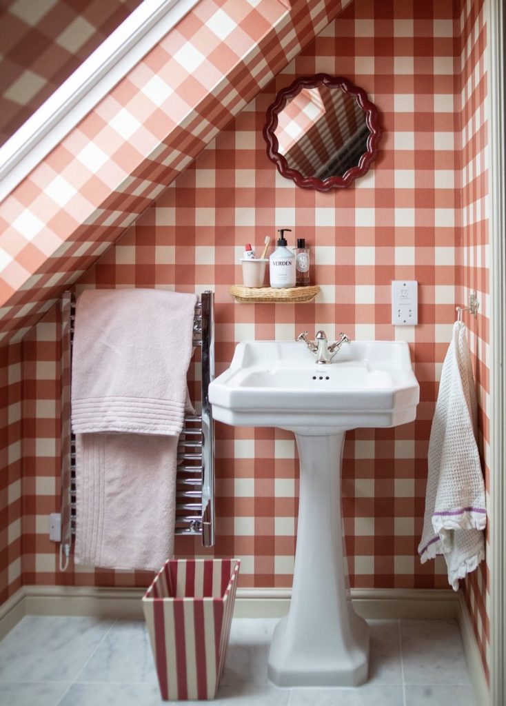 Attic bathroom with wallpaper 