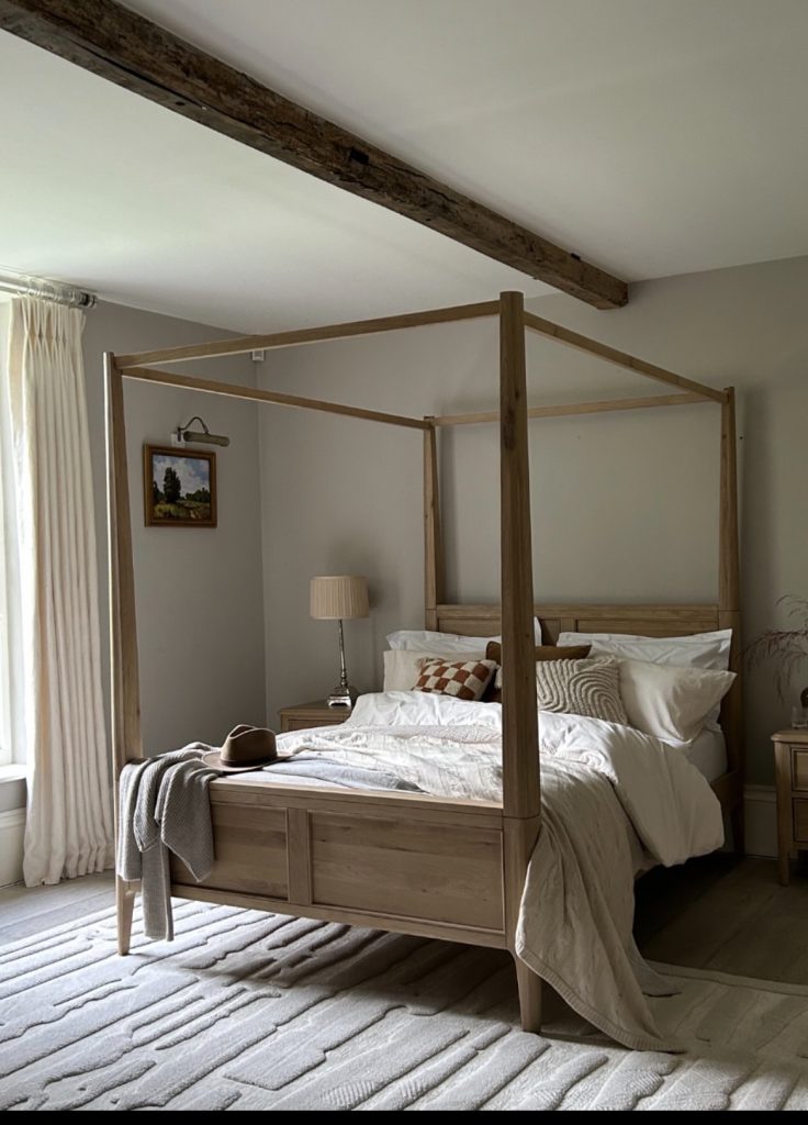 Four poster wood canopy bedroom