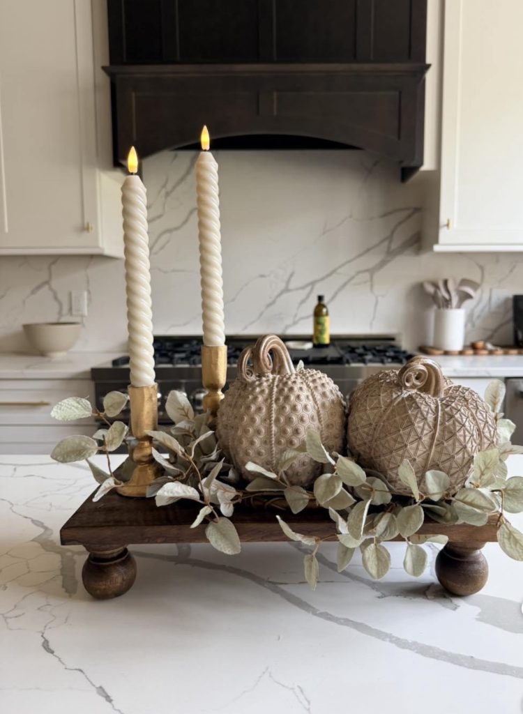 Cluster of candles on Autumn kitchen island 