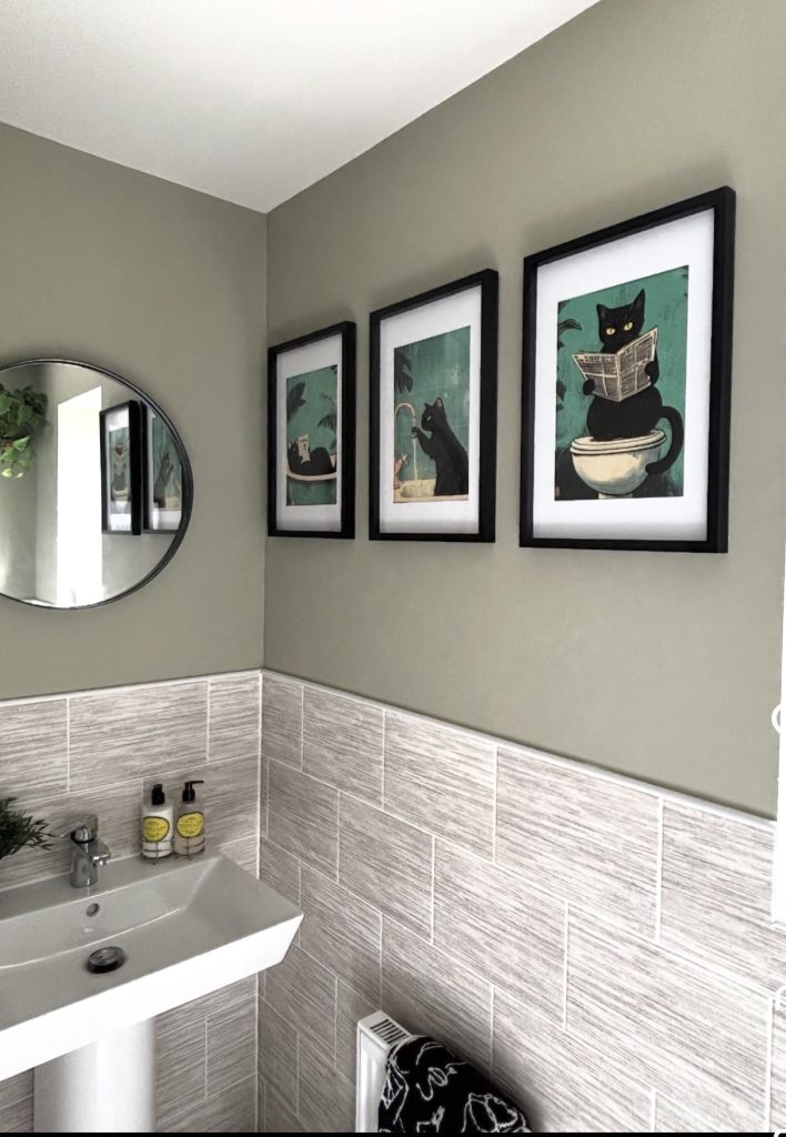 Art gallery wall in bathroom