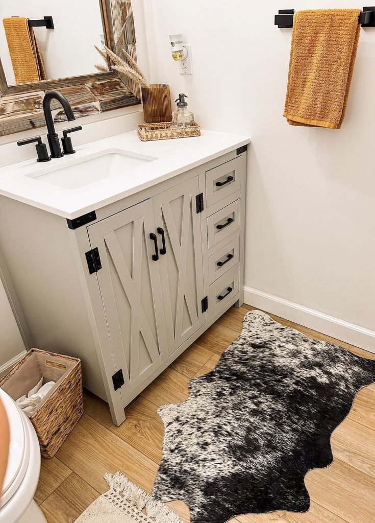 Cowhide rug in a western bathroom 