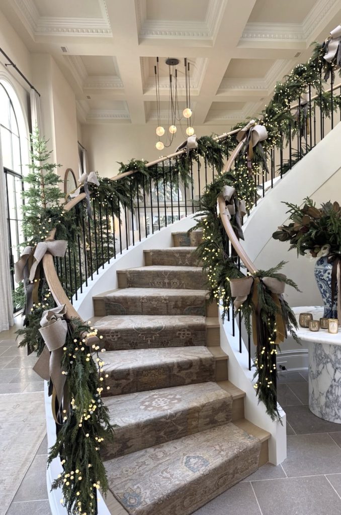 Twinkle lights used in decorating staircase railings 