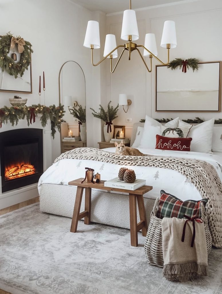 Candles and warm light in a bedroom decorated for rustic Christmas 