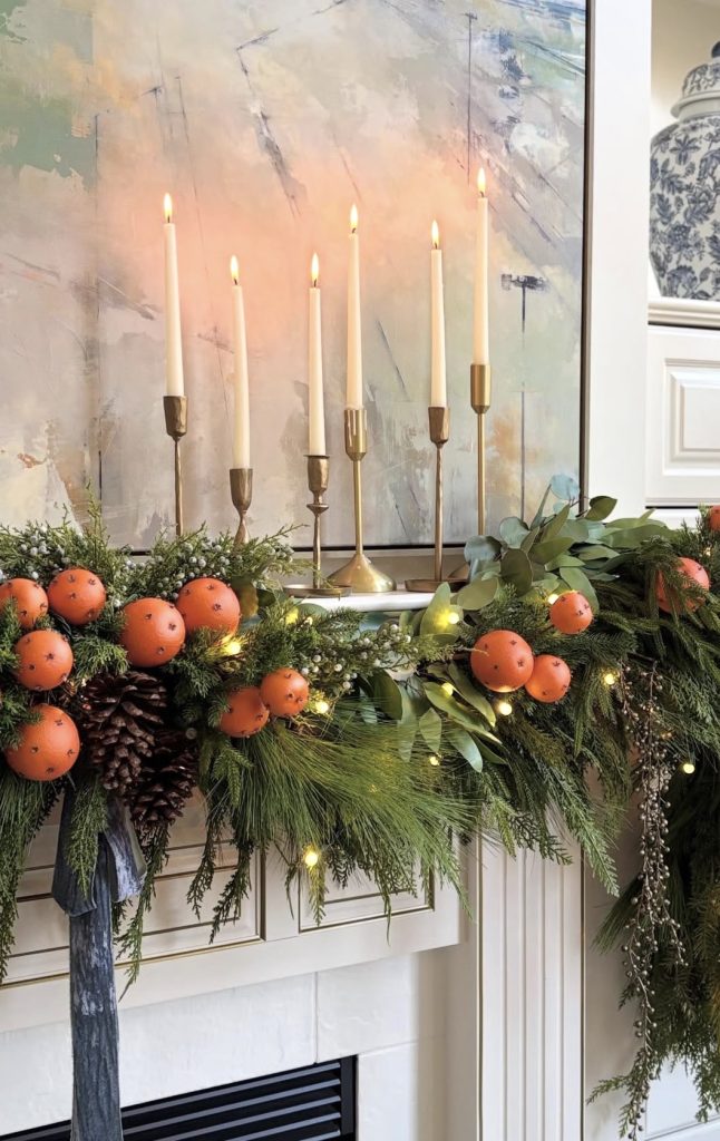 Candle and Warm lights on a Mantel
