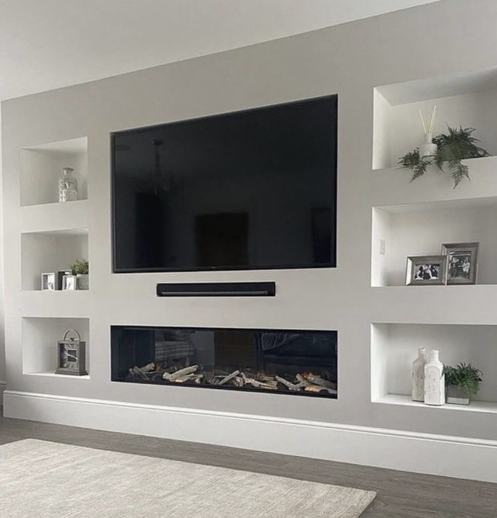 White Fireplace Wall With a TV Above