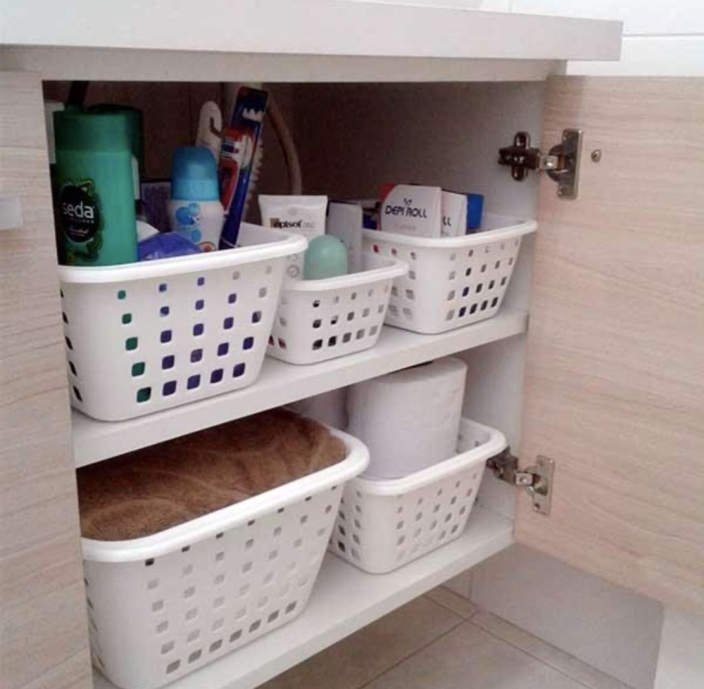 Use Small Plastic Bins to Organize the Bathroom Cabinet