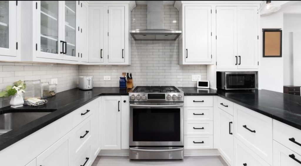 Black Countertop With White Cabinets