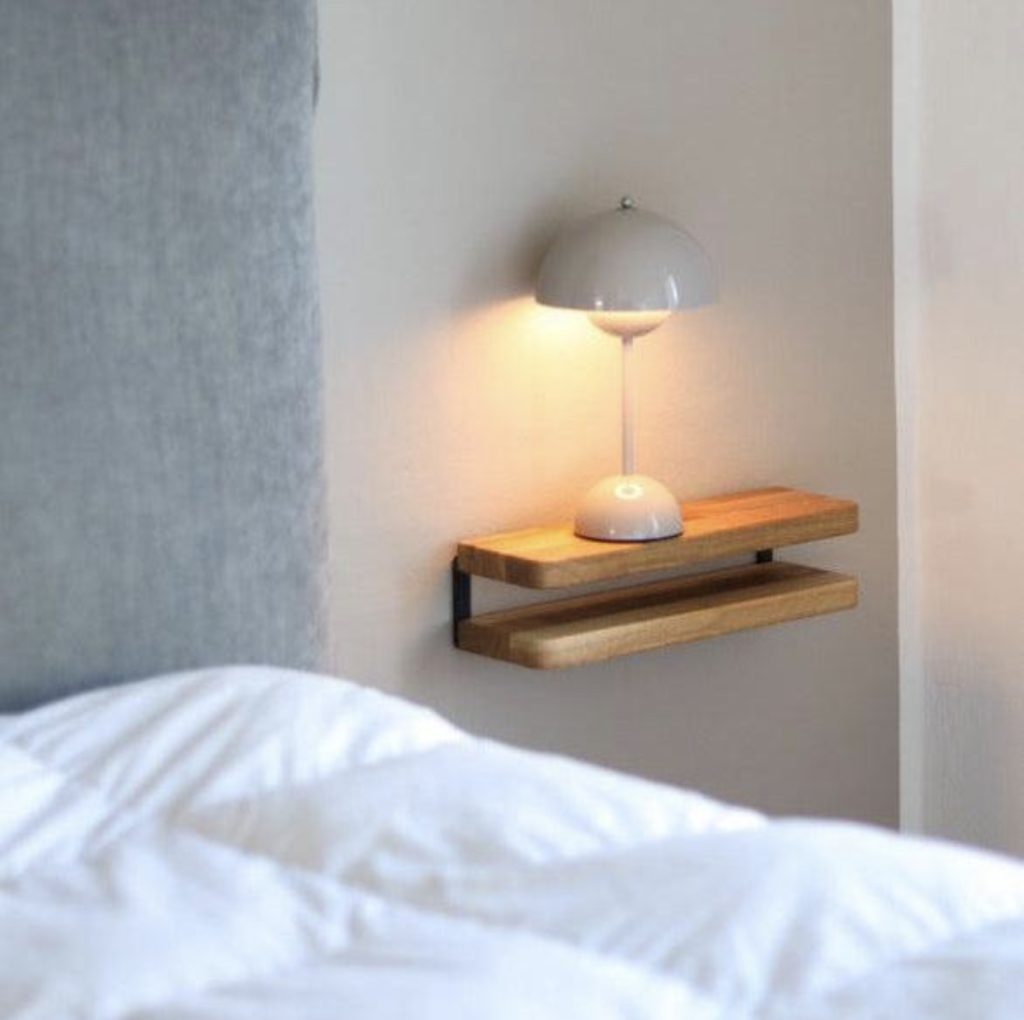 Floating shelves in a small bedroom 