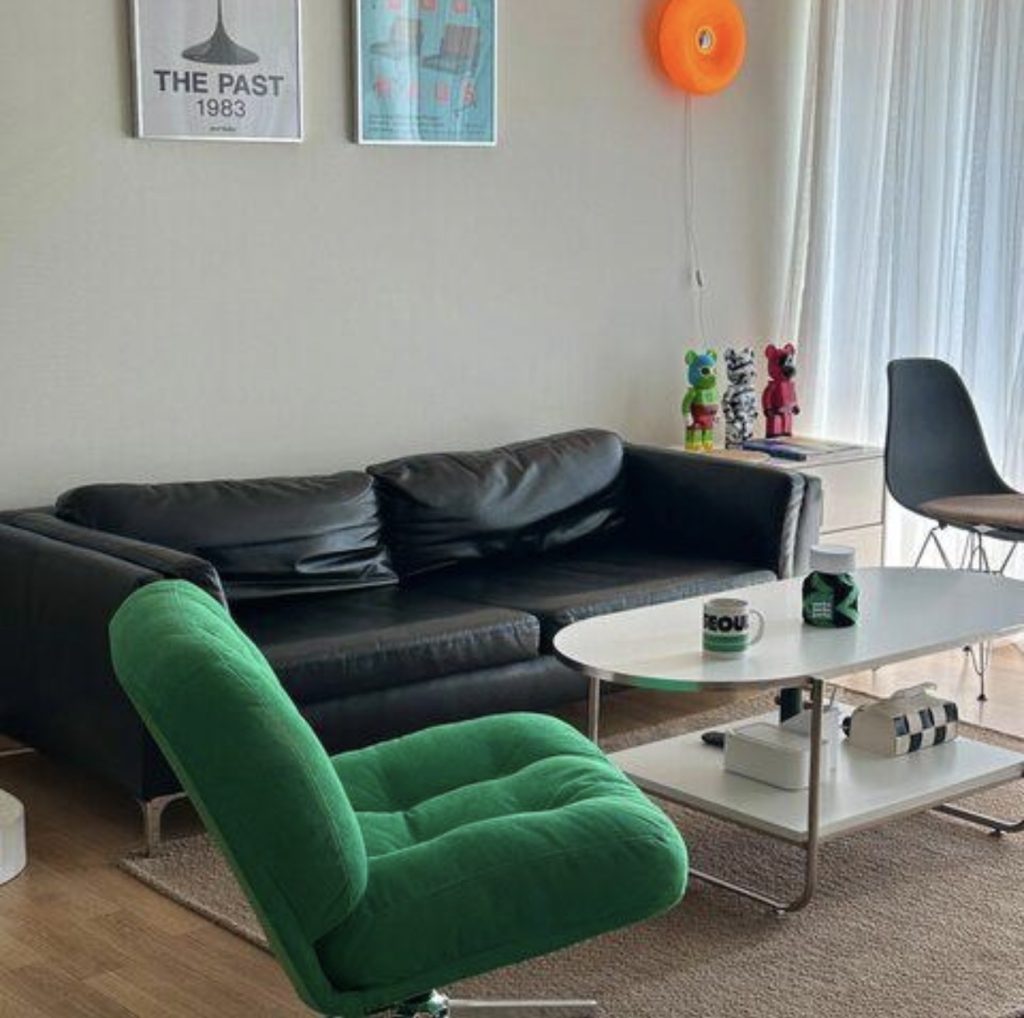 Emerald Green Accent Chair With a Black Sofa