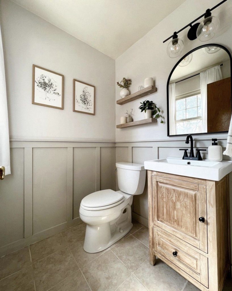 Warm Beige Wainscoting With a Round Mirror